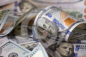 cuved U.S. 100 dollar banknotes background