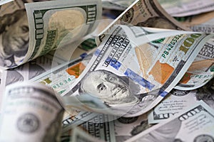 cuved U.S. 100 dollar banknotes background