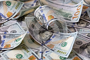 cuved U.S. 100 dollar banknotes background