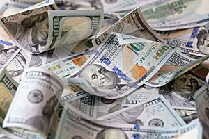 cuved U.S. 100 dollar banknotes background