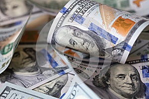 cuved U.S. 100 dollar banknotes background