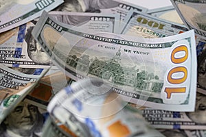 cuved U.S. 100 dollar banknotes background