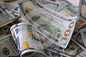 cuved U.S. 100 dollar banknotes background