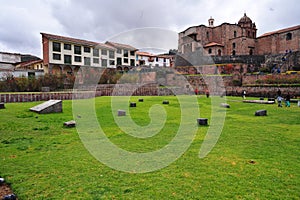 Cuzco city ancient Inca Temple of the Sun Coricancha landscape with garden at sunny summer day. Coricancha, Qoricancha or