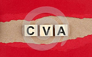 CVA word on wooden cubes on red torn paper , financial concept background photo