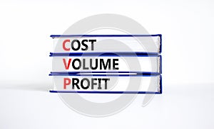 CVP cost volume profit symbol. Concept words CVP cost volume profit on books on a beautiful white table white background. Business