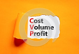 CVP cost volume profit symbol. Concept words CVP cost volume profit on white paper on a beautiful orange background. Business and