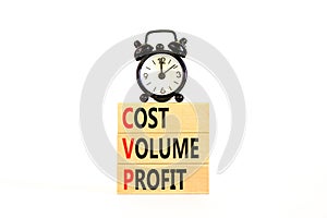 CVP cost volume profit symbol. Concept words CVP cost volume profit on wooden blocks on a beautiful white background. Black alarm