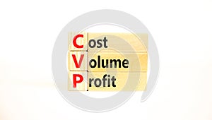 CVP cost volume profit symbol. Concept words CVP cost volume profit on wooden blocks on a beautiful white table white background.