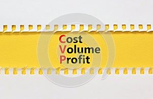 CVP cost volume profit symbol. Concept words CVP cost volume profit on yellow paper on a beautiful white paper background.