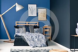 Cyan bedroom with wooden furniture