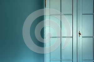 Cyan blue wall with cupboard stylish interior,modern blue cupboard door background texture beautiful luxury house