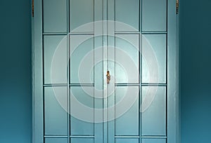 Cyan blue wall with cupboard stylish interior,modern blue cupboard door background texture beautiful luxury house