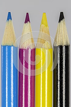 Cyan Magenta Yellow Black pencils macro shot
