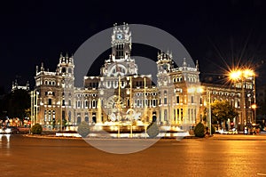 Cybele palace on Cibeles square plaza de Cibeles at night, Madrid, Spain photo