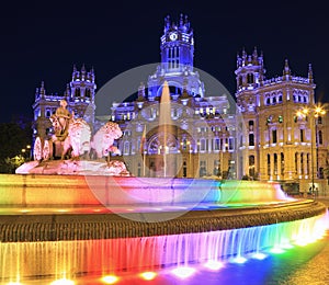 Cybele Palace and fountain illuminated at night in Madrid, Spain photo