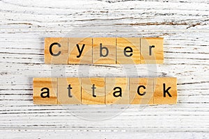cyber attack word made with wooden blocks concept