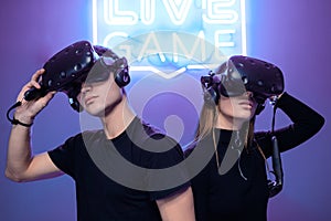 Cyber battle in VR reality. Playing in a neon room.