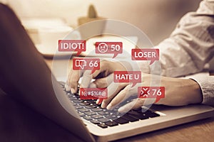 Cyber bullying concept. people using notebook computer laptop for social media interactions with notification icons of hate speech photo