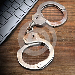 Cyber Crime Concept, Gavel Keyboard And Handcuffs On The Table