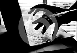 Cyber crime hand reaching out through laptop computer and attack