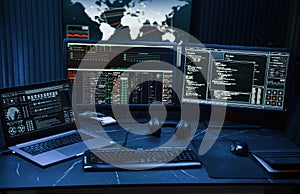 Cyber criminal haker dark room for massive attack of corporate big data servers photo
