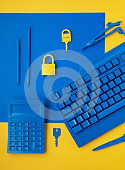 Cyber data and information security idea. Yellow padlock and key and blue keyboard. Computer, information safety, confidentiality