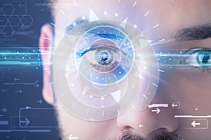 Cyber man with technolgy eye looking into blue iris