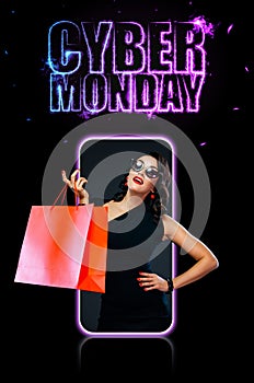 Cyber monday sale concept for shop. Woman with computer isolated on dark background on black friday holiday. Template