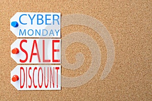 Cyber Monday sale tags are pinned to the cork board