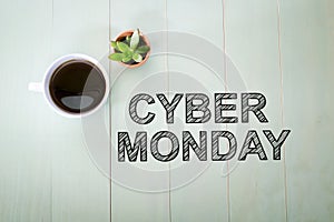 Cyber Monday text with a cup of coffee