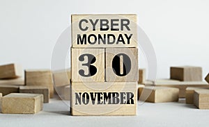 CYBER MONDAY is written on wooden cubes stacked in the form of a mobile calendar