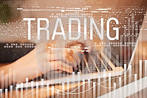 Cyber online trading and business, female hands typing on laptop.