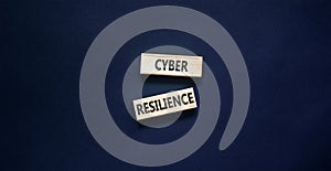 Cyber resilience symbol. Concept word Cyber resilience typed on wooden blocks. Beautiful black table black background. Business
