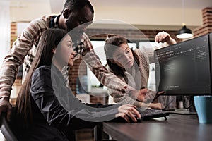 Cyber security agency multiethnic team encrypting mainframe database