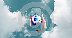 Cyber Security on Cloud Technology Concept. Securing Cloud Computing Online Systems. Hand Holding Smart Phone with Padlock,