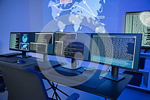 Cyber security command center with multiple monitors displaying data analysis and network information
