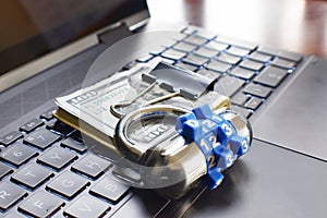 Cyber Security Concept With Combination Lock And Money Resting On Laptop Computer Keyboard