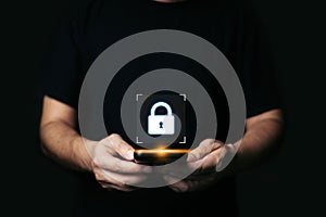 Cyber security concept, man hand holding smartphone protection network with lock icon and virtual