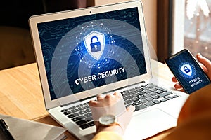 Cyber security concept. Woman using application on laptop and phone