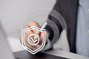 Businessman uses digital pencil to enter code to protect business and financial data with cloud computing system