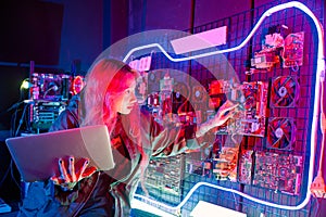 Cyber security. Software engineer holding laptop computer at data center