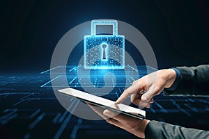 Cyber security technology and business and financial data protection concept with man hands using digital tablet on dark