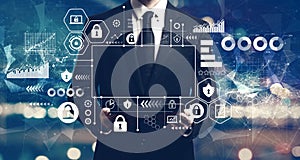 Cyber security theme with businessman holding a tablet