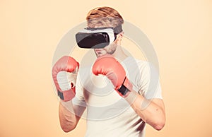 Cyber sportsman boxing gloves. Man play game in VR glasses. Cyber sport concept. Man boxer virtual reality headset