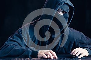 Cyber terrorist in black mask