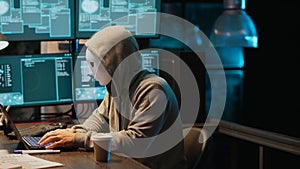 Cyber terrorist with mask hacking database servers