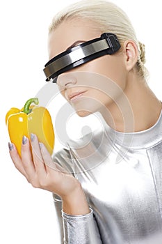 Cyber woman with sweet pepper photo