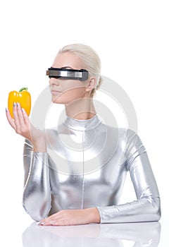 Cyber woman with sweet pepper photo