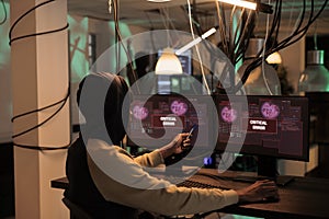 Cyberattack alert message on computer screen, hacker stealing password